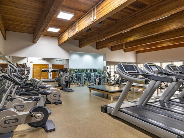 gym with wooden ceiling and a high ceiling