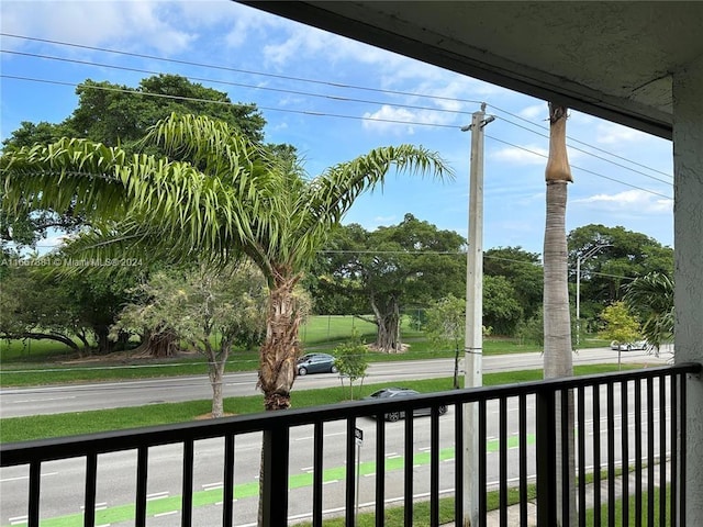 view of yard featuring a balcony