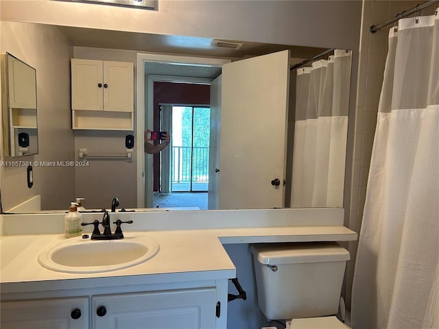 bathroom with a shower with shower curtain, toilet, and vanity