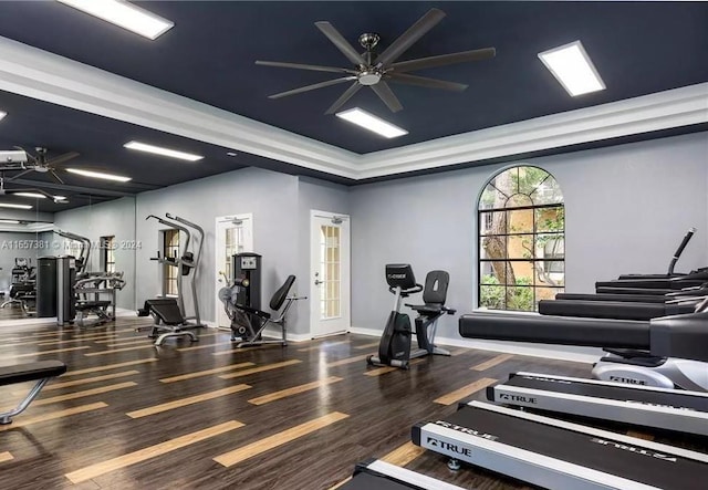 gym with hardwood / wood-style flooring and ceiling fan