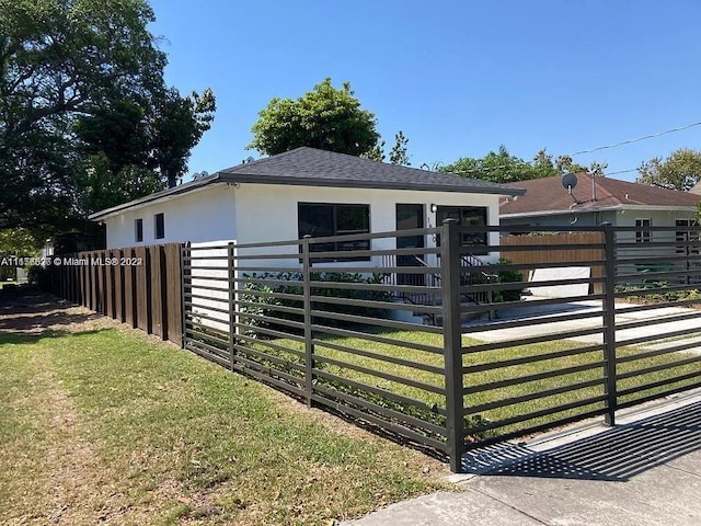 exterior space featuring a front lawn