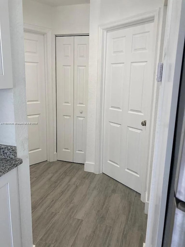 1810 NW 69th Ter, Miami, FL 33147 - unfurnished bedroom with wood finished floors and a closet