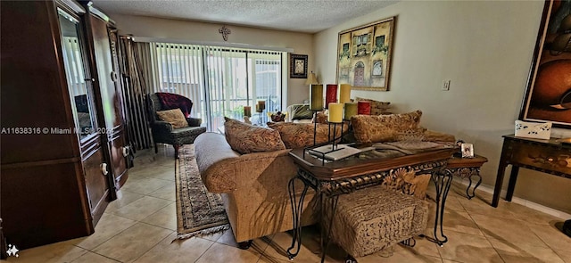 tiled living room featuring a textured ceiling