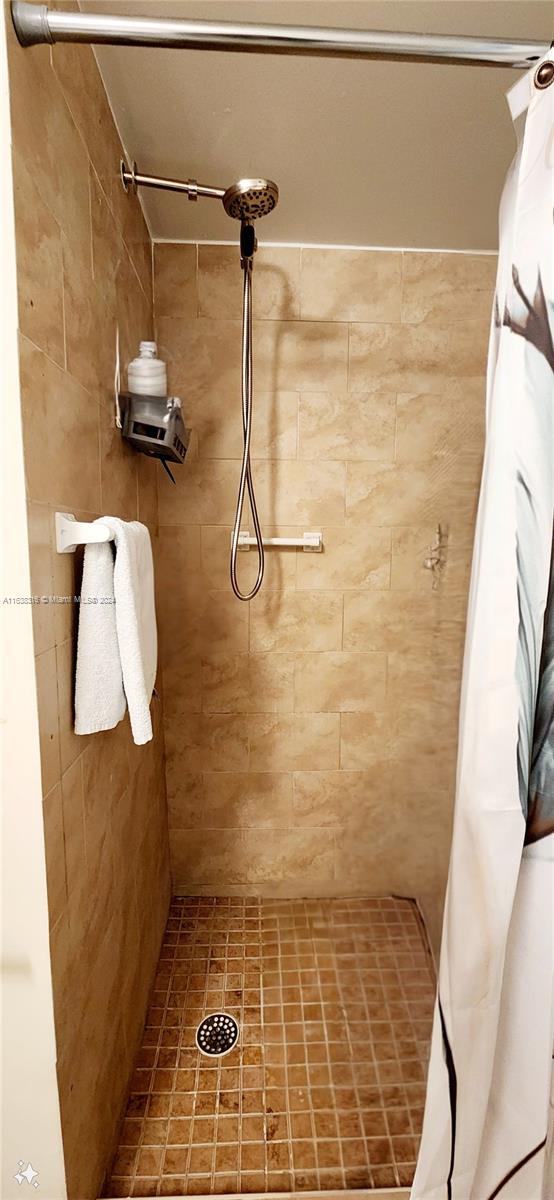 bathroom with a shower with curtain