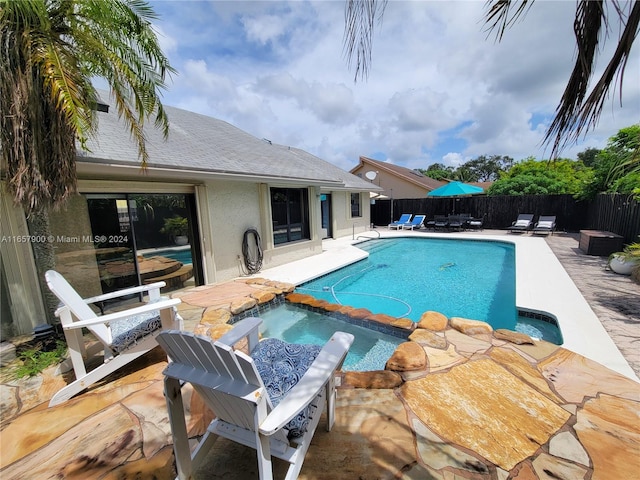 view of swimming pool with a patio area