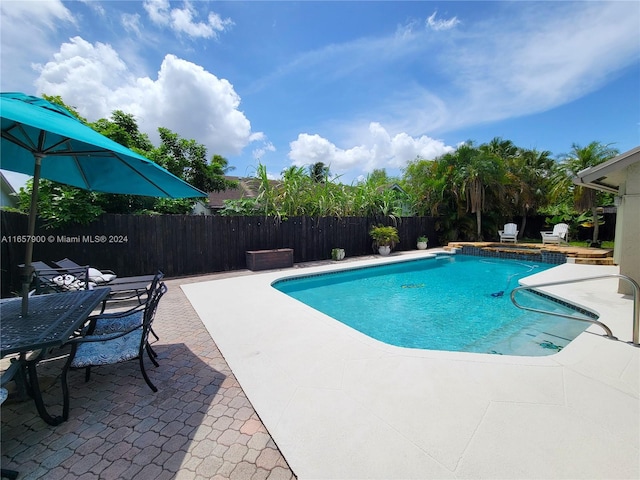 view of pool with a patio area, a fenced in pool, and fence private yard