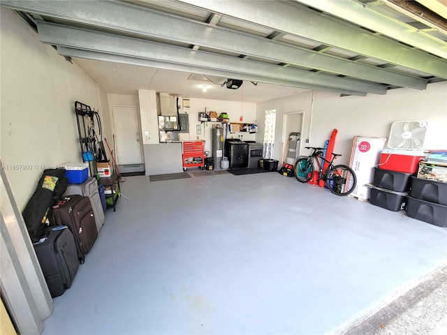 garage with water heater and a garage door opener