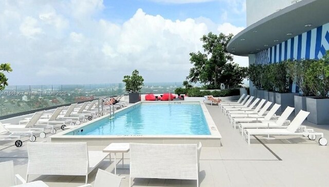 view of swimming pool featuring a patio