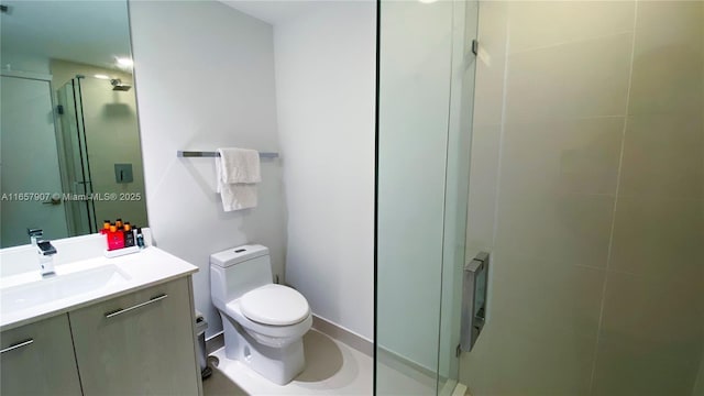 bathroom with a shower with shower door, toilet, and vanity