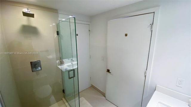 bathroom featuring an enclosed shower