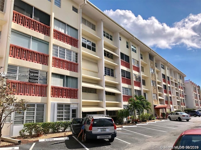 215 SE 3rd Ave Unit 407B, Hallandale Beach, FL 33009 - view of building exterior with uncovered parking