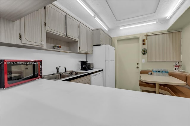 215 SE 3rd Ave Unit 407B, Hallandale Beach, FL 33009 - kitchen with light countertops, a sink, open shelves, and white appliances