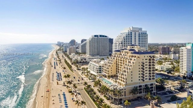 property's view of city with a view of the beach and a water view