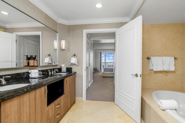 bathroom with ornamental molding, a bath, and vanity