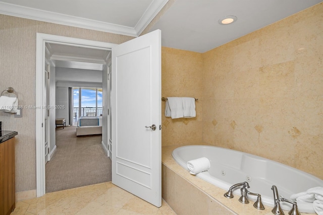 bathroom featuring crown molding and a bathing tub