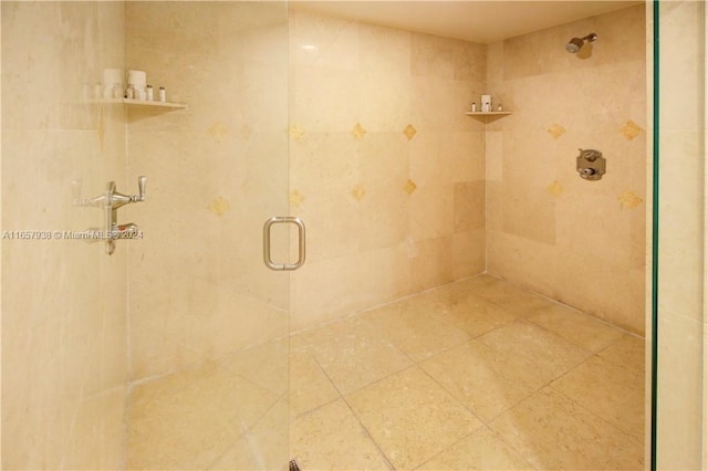 bathroom with a shower with shower door