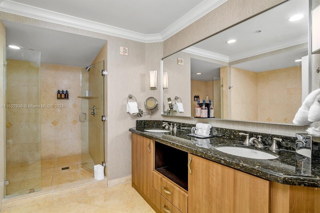 bathroom featuring tile patterned flooring, vanity, a shower with door, and crown molding