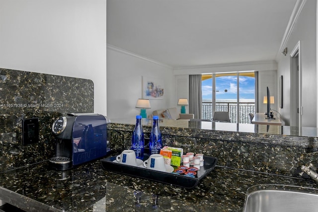 kitchen featuring sink and crown molding