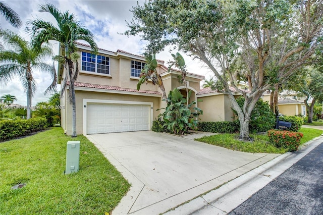 mediterranean / spanish home with a front lawn and a garage