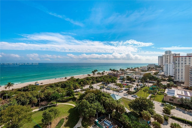 bird's eye view featuring a water view and a view of the beach