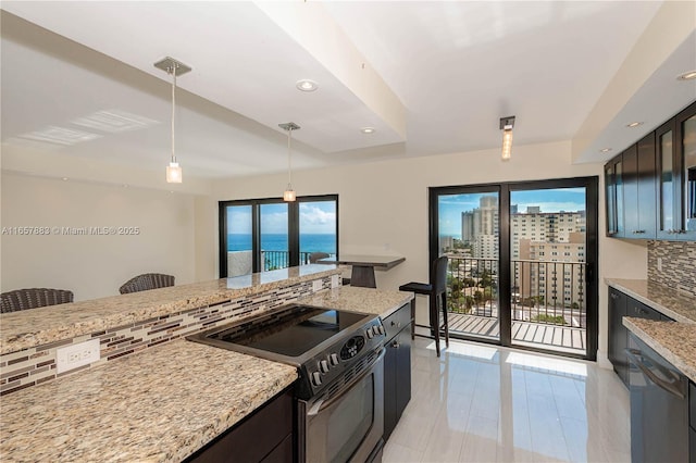 kitchen featuring a water view, stainless steel electric range, dishwasher, pendant lighting, and backsplash