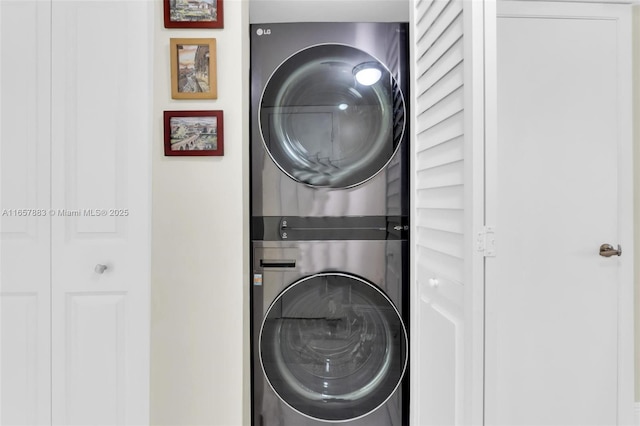 laundry room with stacked washer / drying machine