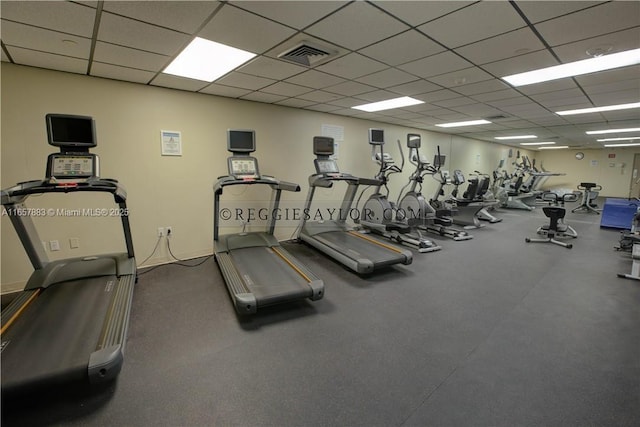 exercise room featuring a drop ceiling