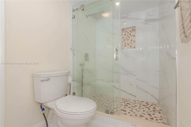 bathroom with an enclosed shower and toilet