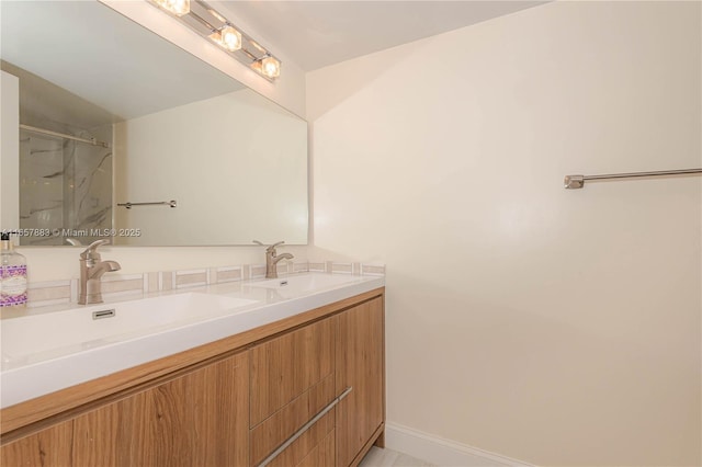 bathroom with walk in shower and vanity