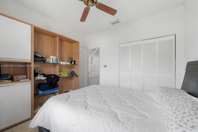 bedroom with ceiling fan and a closet