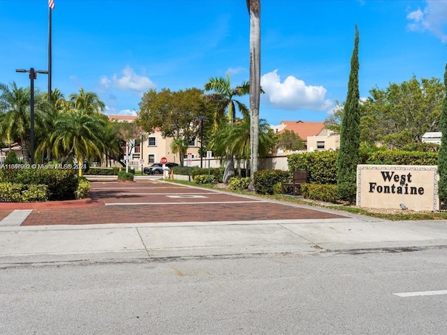 view of community with uncovered parking and a residential view