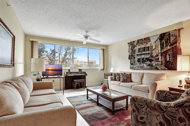 living room featuring a textured ceiling and ceiling fan