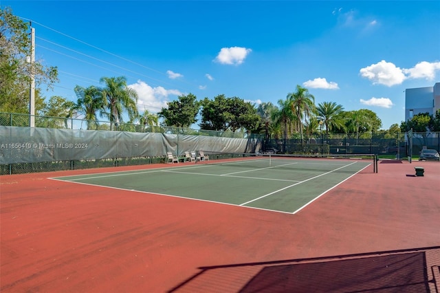 view of tennis court featuring basketball court