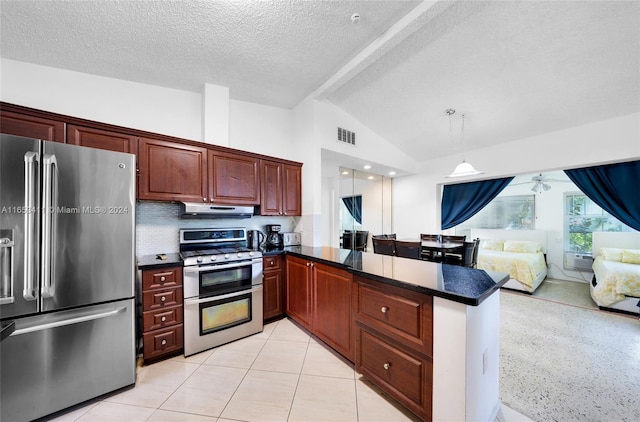 kitchen featuring a peninsula, dark countertops, visible vents, lofted ceiling, and appliances with stainless steel finishes