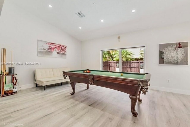 game room with lofted ceiling, billiards, and light hardwood / wood-style flooring