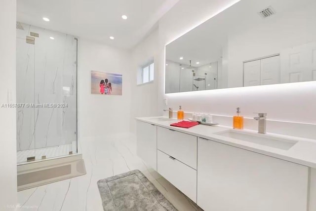 bathroom with a shower with door and vanity