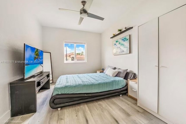 bedroom featuring light wood-type flooring and ceiling fan