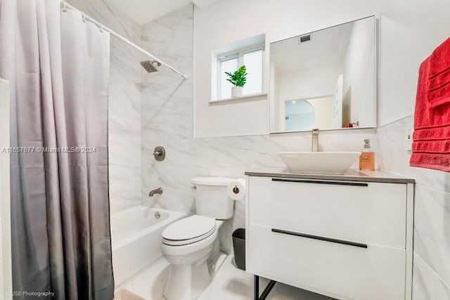 full bathroom with toilet, tile walls, shower / tub combo, decorative backsplash, and vanity