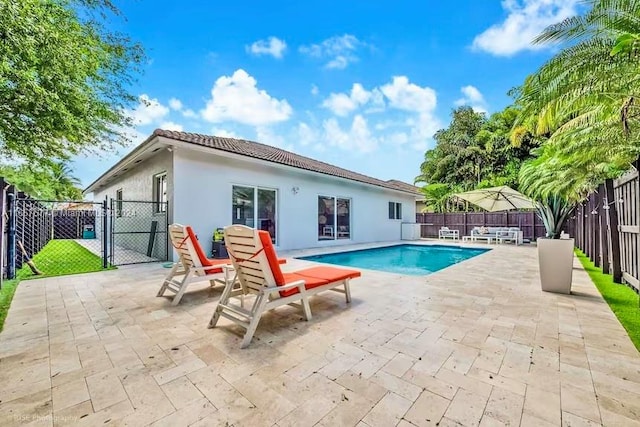 view of swimming pool with a patio area