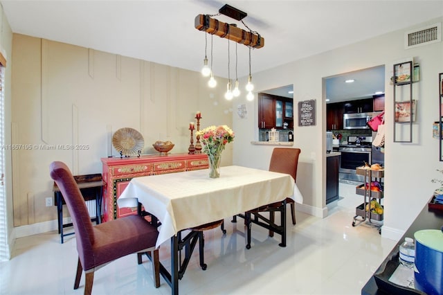 dining area with light tile patterned flooring