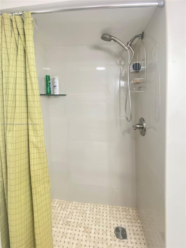 bathroom with a shower with shower curtain