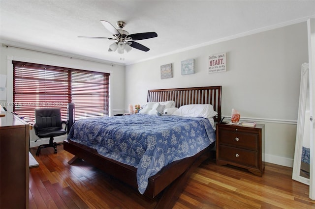 bedroom featuring ceiling fan, crown molding, and hardwood / wood-style floors