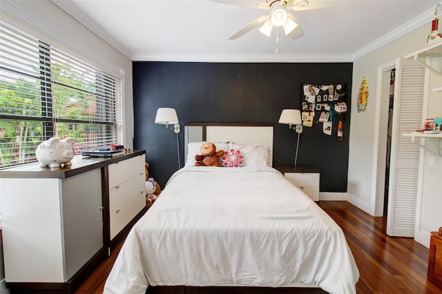 bedroom featuring ceiling fan, dark hardwood / wood-style flooring, and ornamental molding