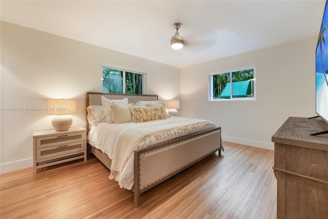 bedroom featuring wood-type flooring and ceiling fan