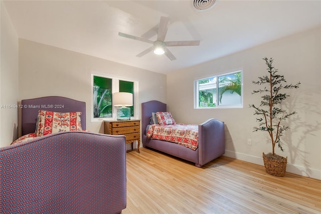 bedroom featuring light hardwood / wood-style flooring and ceiling fan