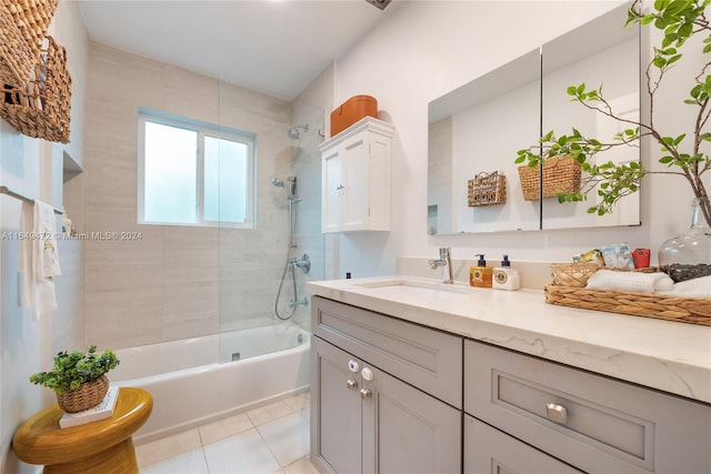 bathroom featuring vanity, tiled shower / bath combo, and tile patterned floors