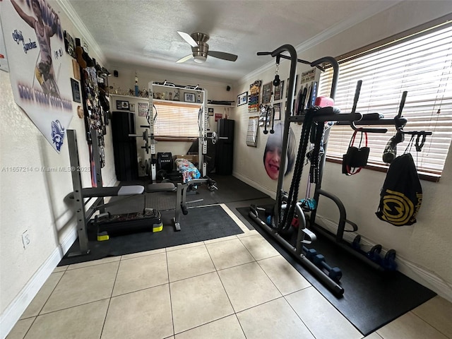 exercise room with light tile patterned flooring, ceiling fan, crown molding, and a textured ceiling