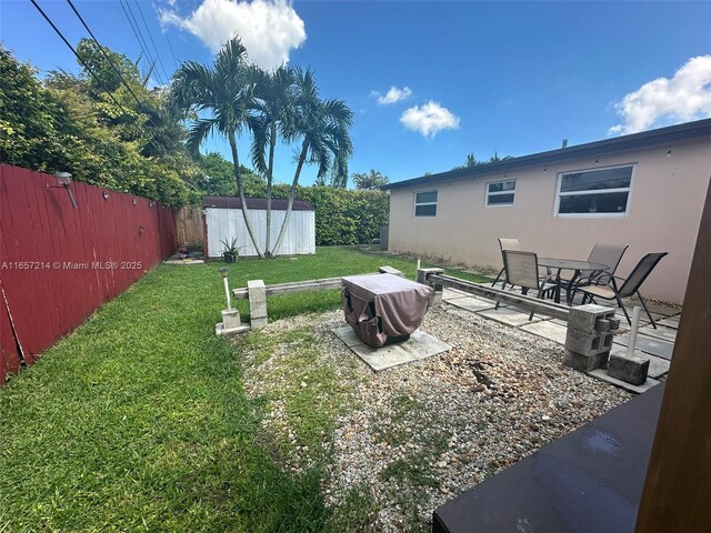 view of patio / terrace featuring a shed