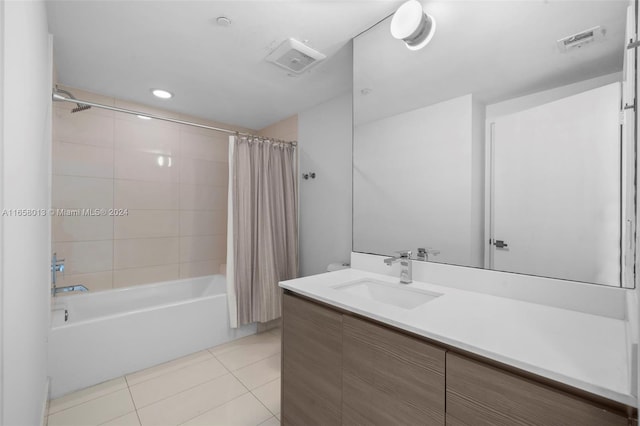 full bath featuring tile patterned floors, visible vents, shower / bath combo, and vanity