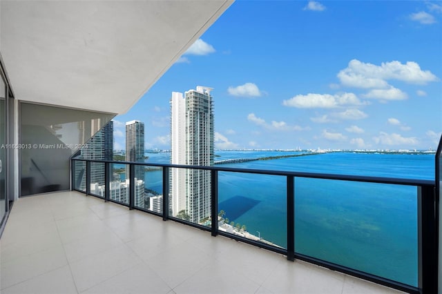 balcony with a view of city and a water view